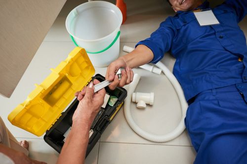 638a6b49698caa111f34ac4b_top-view-plumber-checking-kitchen-fixtures-p-500